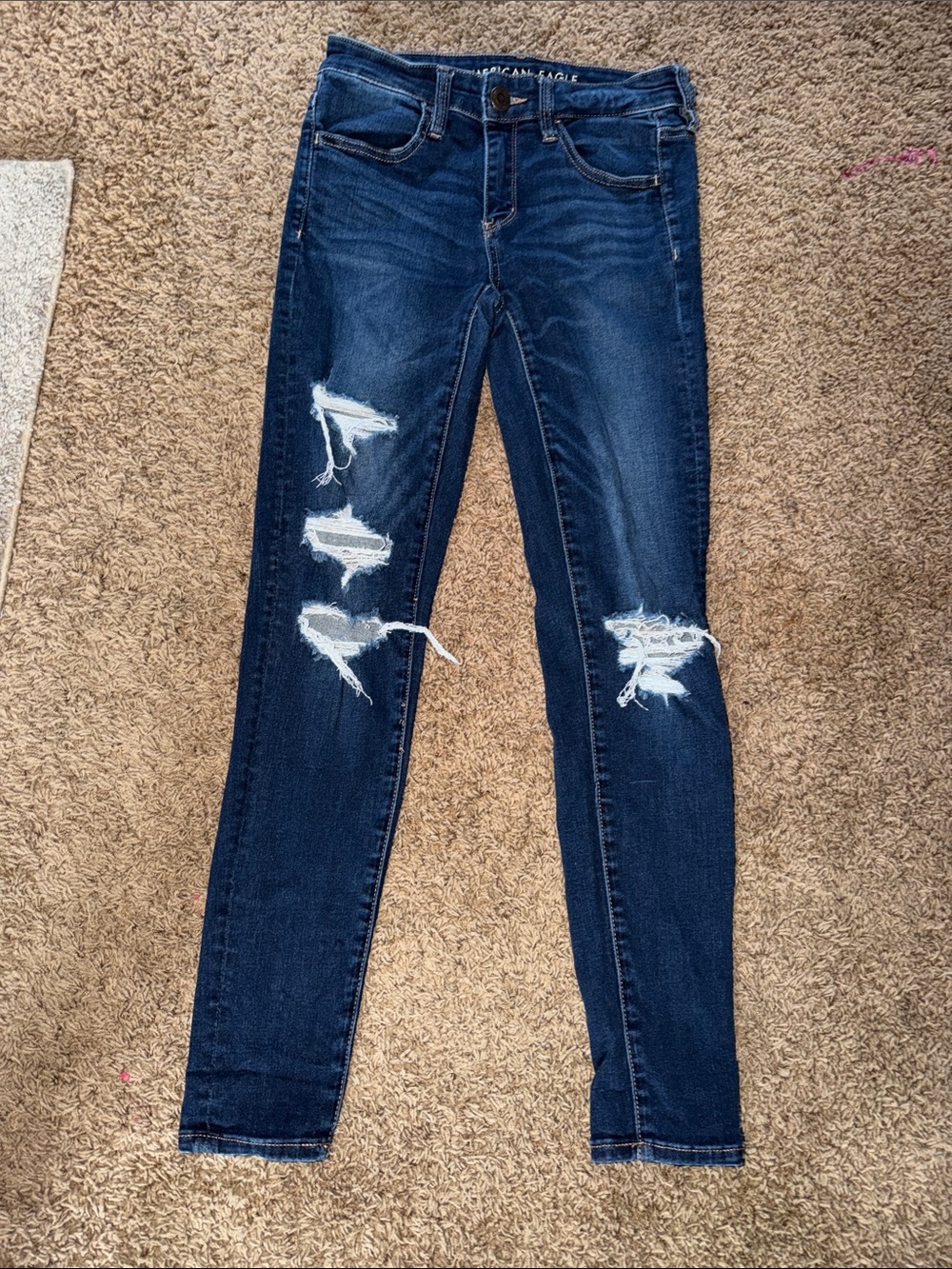 (USED-gently)American Eagle Dark Blue Distressed Skinny Jeans - Women size 6